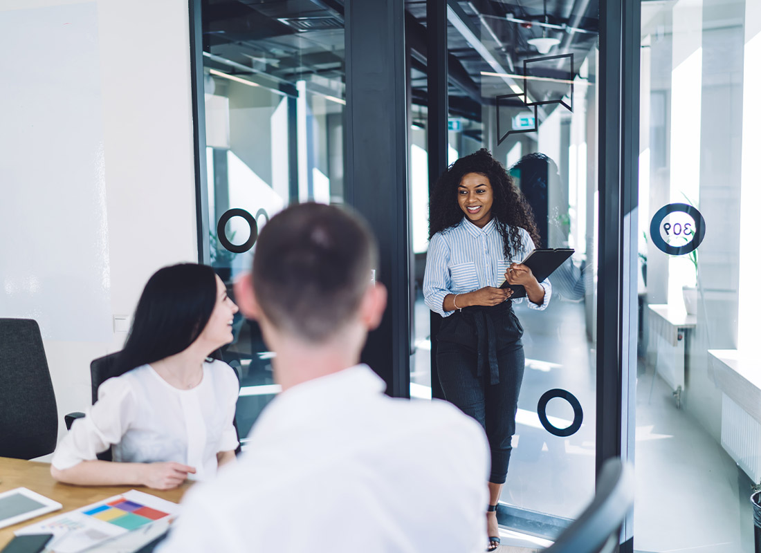 Employee Benefits HR - Woman Walking into Conference Room for a Job Interview